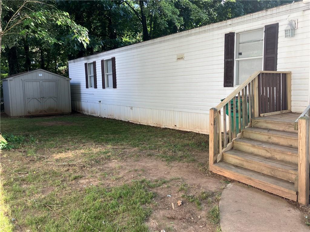 View of yard with a shed