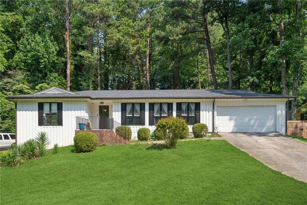 Beautiful ranch home located in the desirable Hidden Hills subdivision. This spacious residence offers 3 bedrooms and 2.5 bathrooms on the main level, plus a finished basement featuring an additional bedroom or office, a full bath, and a private entrance—ideal for guests or a home office setup. The basement also includes an unfinished area with potential for further customization. Enjoy outdoor entertaining on the oversized deck overlooking a private, tree-lined backyard.