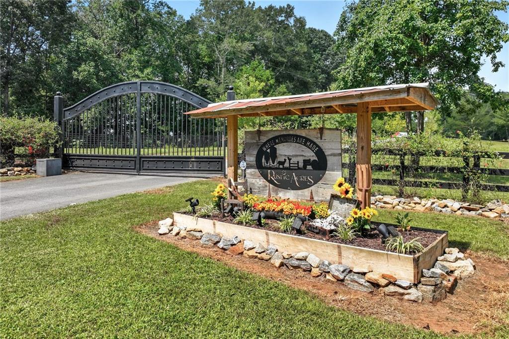 Discover the perfect blend of country charm and modern convenience with this beautifully remodeled Manufactured home set on a permanent foundation. Nestled on 26 acres with 200+ Feet of Hudson River Frontage, this property offers privacy, space, and endless possibilities—all just minutes from downtown Commerce and convenient to I-85.
Currently operating as a working mini-farm, the property is fully fenced and features multiple barns and outbuildings, a detached garage, and a 4-stall pole barn ideal for large campers, boats, or farm equipment. A natural pond adds to the serene landscape, while a custom outdoor fire pit or the Hand built pier on the pond makes the perfect gathering spot for family and friends.
Animal lovers will appreciate the opportunity to continue the legacy of this farm: while livestock is not included, the seller is willing to leave behind two cherished donkeys (a bonded mother and son pair) for the right buyer.
Whether you’re seeking a private homestead, hobby farm, or a retreat with abundant space for recreation and storage, this property delivers. With gated drive, gorgeous landscape, and river frontage, it’s truly a rare find.