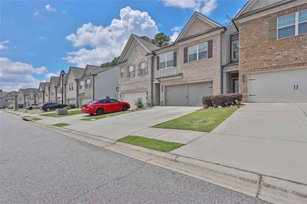 Welcome to 2509 Irwell Way - a modern two-story townhome in the desirable Manchester Place community Townhome with 3 Bedrooms, 2.5 Bath & 2 car private garage. Hardwoods throughout main floor. House was built in 2019 and is in immaculate condition ready for your family to enjoy. Featuring wide plank LVP flooring on the main level with Granite Countertops, SS appliances, and a kitchen island. The living room is oversized with tons of natural light. Owner's bath features shower only & walk-in closet. Each bedroom includes a walk in closet. Relax in your oversized owner's suite, complete with a walk-in closet and a spa-like bathroom. You'll love living in this pool community Enjoy the convenience of quick access to I-85, with shopping and dining just minutes away. Plus, with Northside Gwinnett Hospital around the corner, you'll have easy access to top rated healthcare. Blending comfort, style, and location, this townhome is a must-see. Schedule your tour today!