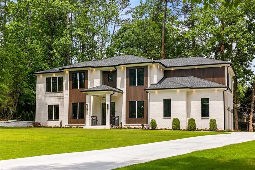 Listed under Appraisal Value! 
Welcome to an architectural masterpiece nestled in the prestigious Indian Hills
community, where golf, swim, and tennis amenities complement this exquisitely
designed home. Upon arrival, custom exterior lighting sets a captivating tone,
warmly inviting you into a residence that blends modern elegance with thoughtful
functionality.
At the heart of the home, the gourmet chef’s kitchen blends sleek modern
aesthetics with high-performance functionality. Custom flat-panel cabinetry pairs
elegantly with marble countertops, while the statement island stuns with a
waterfall edge, rich black and wood tones, geometric underlighting, and artisan
pendant fixtures. The kitchen is outfitted with professional-grade appliances,
including a luxury 60-inch refrigerator, a state-of-the-art 8-burner range with
integrated pot filler. Every culinary detail has been considered, from under-cabinet
LED lighting to soft-close features and illuminated interior shelving.
A seamless flow into the dining and living areas creates an entertainer’s paradise,
further enhanced by a fully finished prep kitchen—perfect for hosting while
keeping culinary artistry behind the scenes.
An elegant transition space between the kitchen and dining room is home to a
custom-built bar area, featuring illuminated cabinetry, under-cabinet wine glass
racks, bottle storage, and a built-in fridge—ideal for sophisticated gatherings
Throughout the home, custom lighting installations elevate each space, including a
stunning chandelier in the grand foyer, sleek recessed lighting, and an illuminated
modern glass staircase that commands attention as a central design element. The
home also offers an elevator shaft, ready for future installation.
The primary suite is a serene retreat flooded with natural light, highlighted by
warm fire place, hardwood floors and a striking feature wall with vertical paneling.

The spa-like primary bathroom boasts floating dual vanities with vessel sinks, gold-
accented pendant lighting, a luxurious herringbone-pattern heated floor, and an

oversized glass walk-in shower clad in dramatic marble with multiple showerheads
for a truly indulgent experience.
Additional highlights include 6 spacious bedrooms, 6 luxurious bathrooms, a
versatile bonus room, and two distinct outdoor living areas — one featuring a cozy
fireplace off the living room, and another perfectly suited for an outdoor kitchen
and grilling station.
Completing this remarkable home is an oversized 3-car garage, thoughtfully
designed with ample space for vehicles, storage, or a workshop. Equipped with a
220V electric vehicle charging outlet, this garage seamlessly blends functionality
with future-forward convenience for today’s modern lifestyle.
Every detail of this home has been meticulously curated to deliver an unparalleled
living experience that’s as stunning as it is functional.