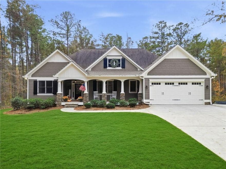 Take a look at this beautiful, custom built ranch in Cherokee County! Not only does this home sit on over an acre, it sits far off the road with a nice, long driveway - the lot is amazing and probably the most private in the neighborhood. It offers a beautiful front and back yard that has been meticulously maintained. This home features an open concept, split bedroom floor plan with the owner's suite + 2 secondary bedrooms on the main level, a large kitchen island and ample cabinet space in the kitchen, a walk-in pantry, a gas cooktop, hardwood floors, two walk-in closets + an additional closet in the owner's suite, a screened-in back porch with an outdoor fireplace - a perfect place to relax, tongue and groove ceilings on the front and back porches, fresh exterior paint (2024) and so much more. The terrace level was finished in 2023 to include a large living room, a full bathroom and 2 additional bedrooms (or an office), plus plenty of unfinished storage space. This home has been extremely well maintained, and it's apparent as soon as you pull up. The location offers easy access to Lake Allatoona, Lake Arrowhead and both I-575 and I-75, sitting right between Canton and Cartersville.