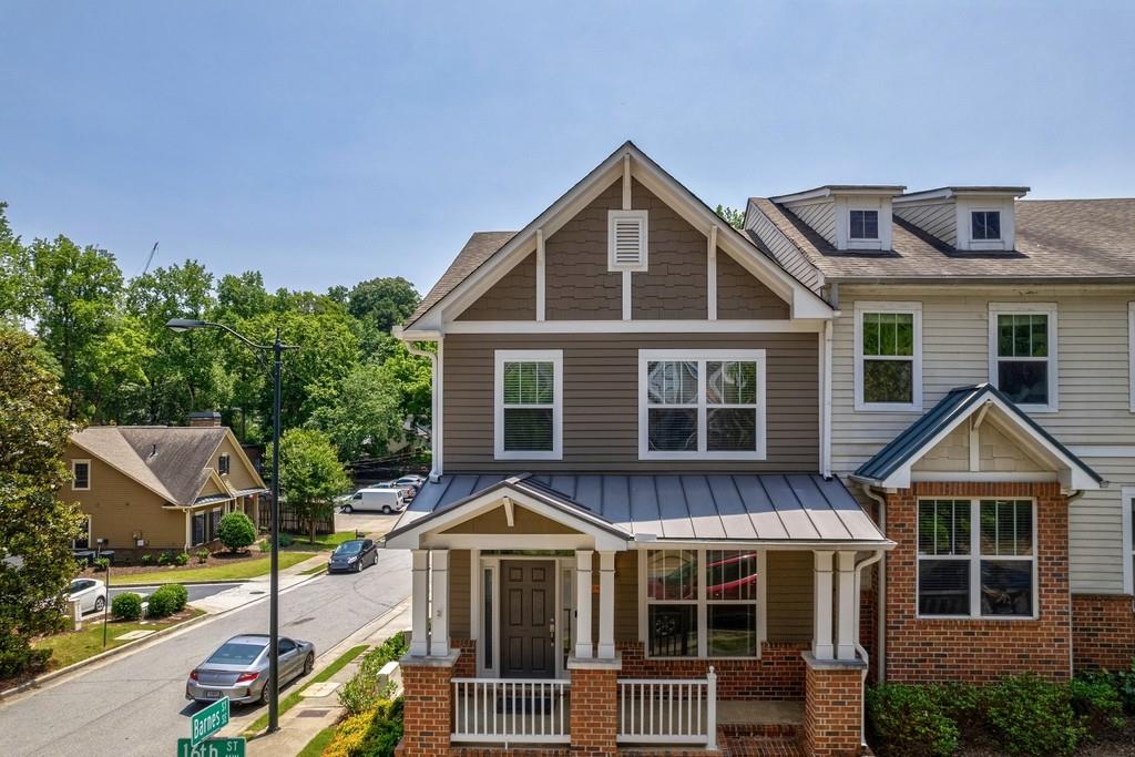 Best lot location in Atlantic Station. Great Opportunity to buy the 1st choice home sold in Atlanta Station in 2004, corner end unit with a city skyline view. Enjoy city living at its best in this 3 Bedrooms (one is a blackout room or use for media room/Office) with 2 full baths and two 1/2 baths. Craftsman's townhome with open concept. Living room with fireplace, spacious kitchen with island for bar sitting. Roommate floor plan- two car garage (hard to find) with a 220 electric charger for car. Enjoy outdoors skyline from back deck, kitchen, dining room and front porch. Renovated Master Bath with 2 walk- in closets. Lots of storage. New deck, Hardwood floors, new light fixtures. Great location with European lifestyle living, walk to Restaurant, movie, shopping, trails, GA. Tech is around the corner. Minutes away from access to the downtown connector and everything the city of Atlanta has to offer.