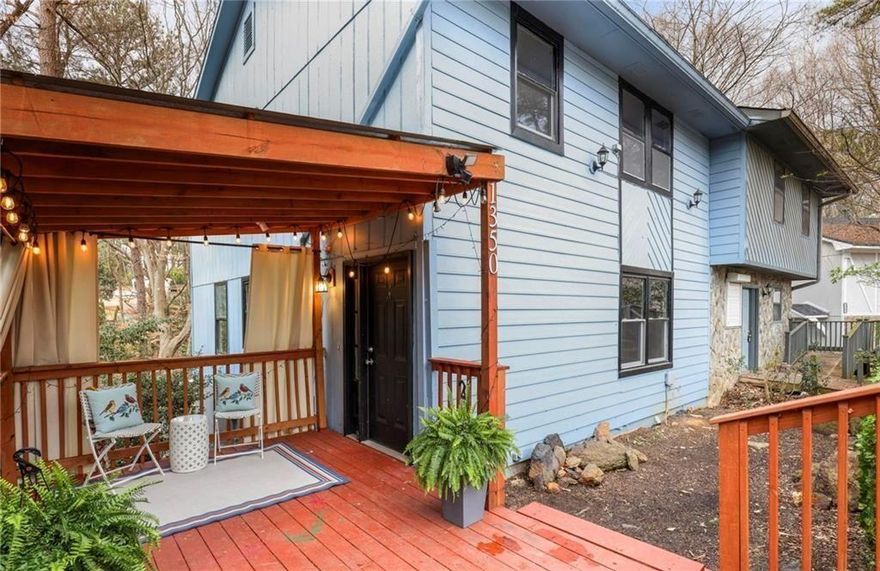 Just minutes from Truist Park (home of the Atlanta Braves).  Cumberland Mall, The Galleria, and Smyrna Market Village, with easy access to I-75 and I-285.  This rare end-unit features 3 spacious bedrooms, 2.5 baths, a basement, and a peaceful deck ideal for entertaining or enjoying nature and birdwatching.  The main floor boasts a generous layout, with room for a dining table, living are, and a  space for a home office.  Upstairs, you'll find stylish LVP flooring and two baths.