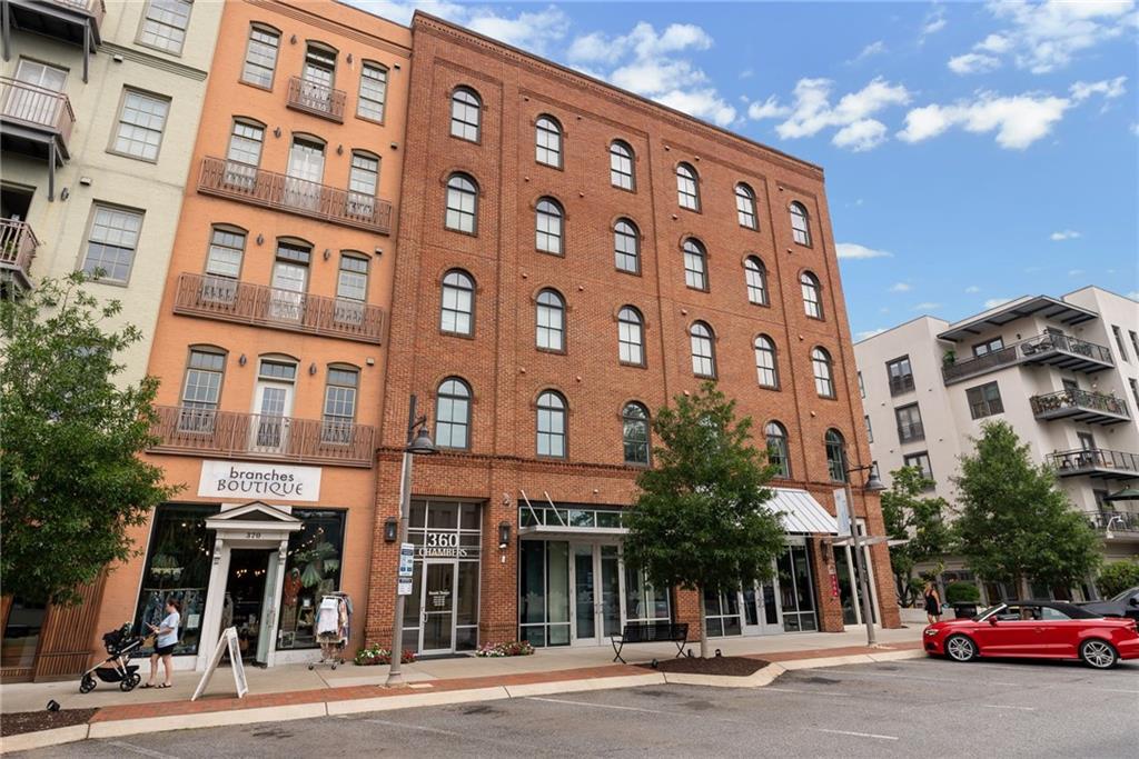 Downtown Woodstock Living - Charming One Bedroom One Bath Condo with Spacious Covered Balcony. Enjoy the ultimate Live-Work-Play lifestyle in highly sought-after Downtown Woodstock! This inviting condo is perfectly located within walking distance of top restaurants, city parks, scenic Greenprint Trails, boutique shopping, the Farmers Market, Elm Street Arts, the new amphitheater, and so much more. The open floor plan offers excellent storage and a comfortable layout, while the large covered balcony is ideal for relaxing or entertaining guests. The unit includes one assigned parking space conveniently located near the building’s entrance. Refrigerator and washer/dryer are included, making this home truly move-in ready.