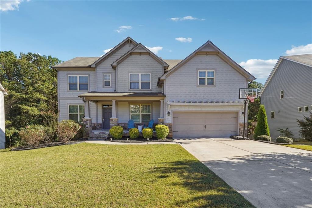 Welcome to the Manchester Floor Plan in Hampton Station by Beezer Homes. Built in 2019 and in pristine condition offering builder upgrades galore! Fall in love with this cozy, 2 story floor plan with full guest bedroom/bath, bonus flex room on main and an unfinished basement ready for you to make it your own! Kitchen boasts Whirlpool stainless steel appliances, 42’ inch cabinets, quartz counters, and walk-in pantry. The view from your kitchen to your family room w/ fireplace is an entertainer’s dream! Oversized owner’s wing, complete with tray ceiling, large owner’s bath with dual vanities, separate shower/tub, and L shaped walk-in closet. Other 2nd level features include a spacious loft area, a bedroom ensuite and two additional bedrooms with plenty of closet space. Back deck access from your kitchen and private views to your backyard make for the perfect combination! Enjoy carefree living in Hampton Station that offers a community pool, playground, basketball court, and swim/tennis. This is one you don’t want to miss!