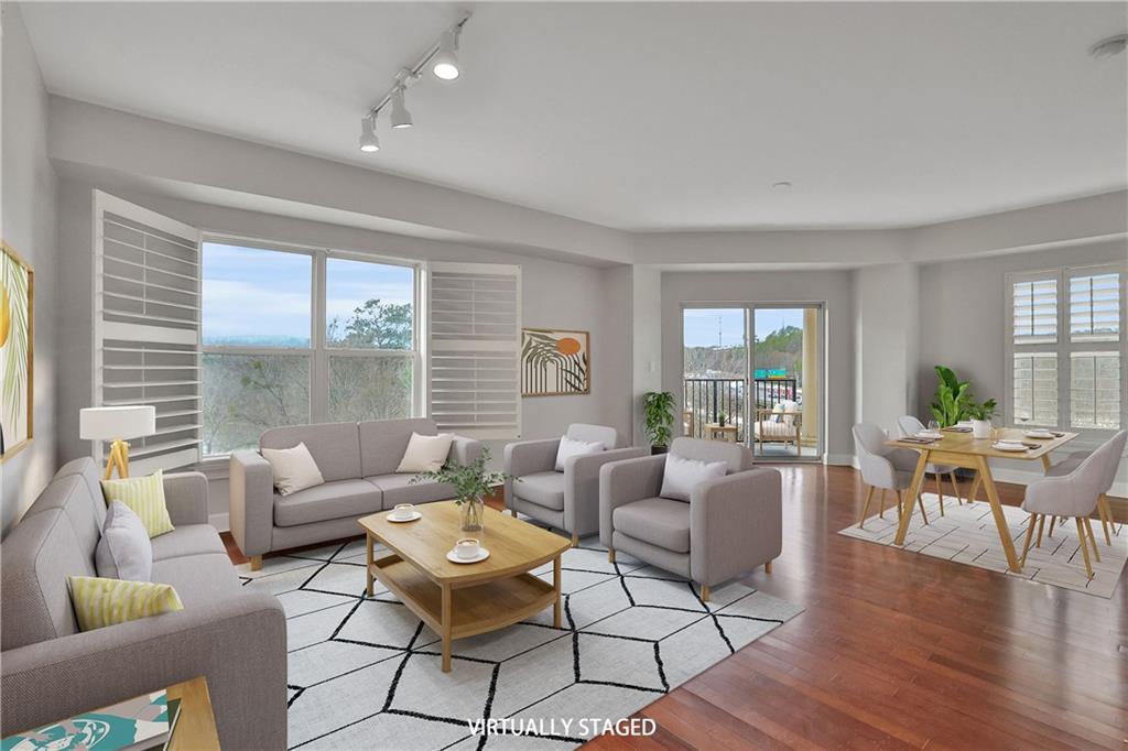 Looking for a home with resort-style amenities and breathtaking views in the Heards Ferry school district? Your search ends here! This 2-bedroom + Office condo offers stunning panoramic views of the majestic Chattahoochee River from every room, combining convenience and beauty just minutes from I-285 and I-75. Featuring one of the most spacious and open floor plans, this condo includes an office, 2 full bathrooms, a guest bath, and a balcony. The kitchen is a true delight with granite countertops, stainless steel appliances, stained cabinets, and a welcoming island. It opens beautifully to the living and dining areas, with a direct view of the balcony. Move-in ready, the condo comes with a washer/dryer, and 2 deeded parking spots (312 & 313) conveniently located on the same 5th-floor parking dock, close to the entrance.

One River Place is a vibrant community with a resort-like atmosphere, hosting numerous social events each month across its 33-acre span along the Chattahoochee River. The amenities are unbeatable: 24/7 gated security and concierge services, two saltwater pools, a grilling area, a clubhouse, a meeting room, a gym with fitness classes, a spa room, a catering kitchen, a fire pit, a dog park, kayak storage, walking trails, and more. With easy access to Truist Park & The Battery, Cochran Shoals Park, Sandy Springs City Center, and major highways, you'll have everything you need at your fingertips. Recently updated with fresh carpeting and paint, this condo invites you to start each day with breathtaking river views.

Don't miss the chance to make this stunning condo your new home. Schedule your private showing today and take the first step towards living your dream, complete with private access to the Chattahoochee River. Isn't that wonderful? ** YOU CAN STILL GET A CONVENTIONAL LOAN ON THIS CONDO, this is one of the few condos that still accept it after the recent changes with Fannie Mae. **