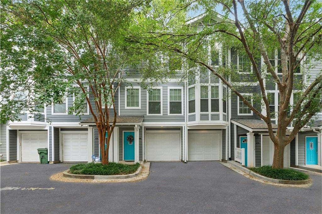 Beautifully maintained 2-bedroom, 2.5-bath townhome in the highly sought-after, gated Grant Park neighborhood—just minutes from the Atlanta BeltLine, Grant Park, restaurants, and shopping. The first level features a 2-car garage with ample storage. The main living level showcases gleaming hardwood floors, an oversized family room with fireplace, and a gourmet kitchen with granite countertops, stainless steel appliances, and a spacious breakfast area. Upstairs, both bedrooms offer walk-in closets and private en-suite baths. The luxurious primary suite includes dual vanities, a separate shower, and a whirlpool soaking tub. Laundry is conveniently located on the upper level. Enjoy low-maintenance living in a prime intown Atlanta location close to parks, trails, and vibrant city amenities.