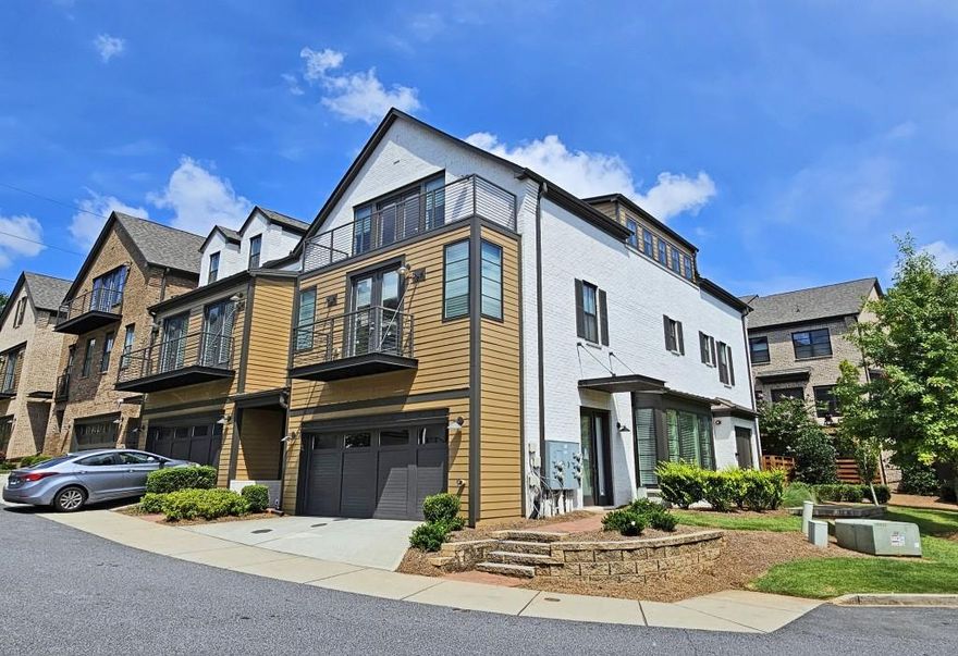 Experience luxury living in the highly sought-after gated Overture at Encore community. Within walking distance to Ameris Amphitheater, shops, and restaurants, this property has it all. The spacious first floor includes a gourmet kitchen, dining room, and large fireside living room. The second floor has three good sized bedrooms, and 2 nicely appointed bathrooms. The owner's suite features a soaking tub, a frameless shower, and sophisticated finishes. The large 3rd floor flexible space includes 3 additional living spaces and a full bathroom. This area is perfect for many uses such as an additional bedroom, home office, gym, media room, or personalized retreat. There are large storage closets on every level! All 3 levels have beautiful hardwoods with plush carpeting in the bedrooms.  The community has a secure gated entrance, a community pool, gathering area and a quiet park, ideal for both relaxation and social engagements.