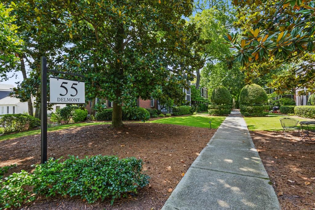 BUCKHEAD'S BEST BUY in charming 55 Delmont - a quiet boutique community of only 16 units nestled in a beautiful setting one block off Peachtree. Adorable END UNIT with NEW AC, REFINISHED HARDWOOD FLOORS, and FRESH PAINT. Enjoy lovely screened porch underneath the shade of beautiful oak trees. Living Room/Dining Room open to the screened porch. Cute updated eat-in kitchen with stainless steel refrigerator, gas range, built-in microwave, and full size DW. Two spacious Bedrooms. Updated tiled bath. Stacked washer/dryer in walk-in laundry room plus a storage area unique to this unit. One deeded parking space plus plenty of parking on Delmont Drive. Walk to Publix, Starbucks, and Barnes & Noble at The Peach Shopping Center. Enjoy historic Garden Hills neighborhood with fantastic parks, Atlanta International School, and Garden Hills Elementary within a block. Your client will love this meticulously maintained community in the heart of Buckhead. Best location in the complex. Check the comps! This unit is priced to sell and shows well.