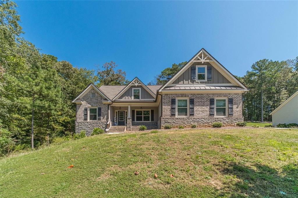 Welcome Home to your breathtaking retreat nestled in the highly sought-after Fairwinds community. This remarkable 4 bedroom, 3 bathroom home sits on an extremely Private wooded lot, bordered by a community-owned greenway to the left and across the street. Step inside and discover a kitchen that will inspire your inner chef, featuring crisp White Cabinets, luxurious Granite Countertops, a large Navy Island with a matching Navy Vent Hood, and top-of-the-line Stainless Steel Appliances, including a Double Oven. The Breakfast Area opens to a cozy, Vaulted Fireside Family Room, where you can imagine yourself relaxing by the glow of the fire on a chilly evening. The spacious Master Suite offers Tray Ceilings and a large walk-in closet, while the Master Bath provides a spa-like escape with Dual Vanities, a Garden Tub, and a Separate Shower. Outside, a covered Back Deck overlooks the peaceful, private backyard, the perfect spot for your morning coffee. The home also features a 2-Car Garage and a full Unfinished Basement that's already framed and stubbed for plumbing, ready for your personal touch. This tranquil home is located in a quiet, well-maintained community and is conveniently close to Award-Winning Schools, Harbin's Park Baseball Complex, Tribble Mill Hiking and Waterfall, Vines Gardens, restaurants, ample shopping options, and more! You're not just buying a home, you're buying a lifestyle!