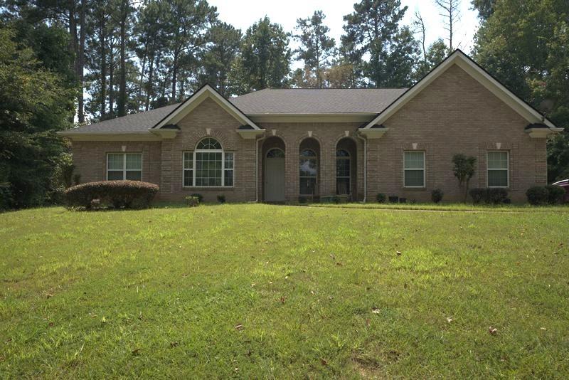 Welcome to this spacious ranch-style, four-sides brick home on a 1.1-acre lot in the rapidly growing Conyers area. Set back with a large backyard bordered by private woods, this property offers both privacy and convenience, just minutes from Route 138.
Inside, the single-level floor plan features 3 bedrooms, 2.5 bathrooms, and a versatile office/den. The vaulted ceilings and open layout create an airy feel, while the screened-in patio provides a perfect space to relax and enjoy the serene views. The secondary bedrooms share a Jack-and-Jill bathroom with dual vanities, while the primary suite features new carpet and plenty of natural light.
The eat-in kitchen is designed for both function and style, offering granite countertops, stainless steel appliances, and a double oven, all overlooking the backyard. A separate dining room is ideal for gatherings and entertaining.
Additional highlights include a new roof (June 2025) and timeless four-sides brick construction. This property is part of an estate sale and being sold as-is. The pricing reflects cosmetic updates and repairs needed, making it a fantastic opportunity to add personal touches and value.