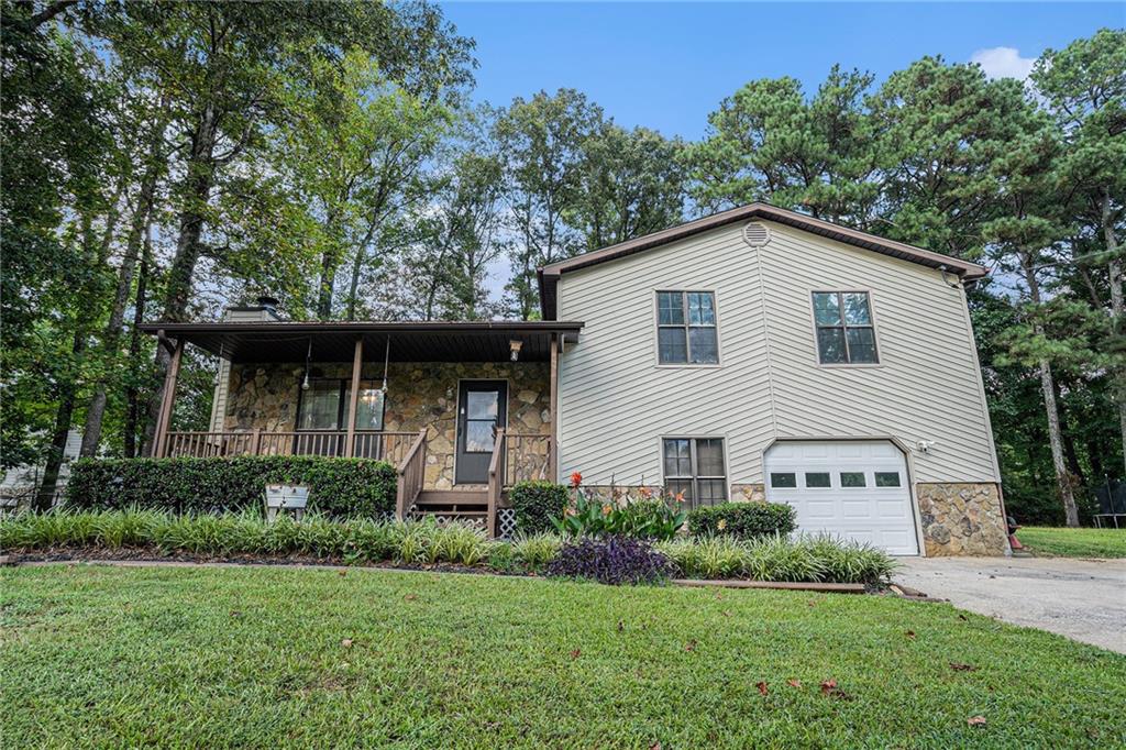 Charming Corner-Lot Home with Finished Basement in Douglasville!
Welcome to this delightful 3-bedroom, 2-bathroom home ideally situated on a spacious corner lot in the heart of Douglasville. Enjoy the serenity of a large, level backyard—perfect for gatherings, pets, or play—complete with a screened-in patio and swing for relaxing year-round.
Step onto the covered front porch and take in peaceful sunrises or relaxing sunsets, rain or shine. Inside, you're greeted by an open-concept living area featuring beautiful hardwood floors and a cozy masonry fireplace—ideal for crisp fall evenings or chilly winter mornings.
The flow continues into the dining area and kitchen, offering seamless sightlines and an ideal layout for entertaining or everyday living. Upstairs, you'll find three generously sized bedrooms, including an oversized master suite with a private ensuite bath, plus a shared full bath off the hallway.
But that’s not all—head downstairs to a finished basement that includes a fourth bedroom or flex space, laundry room, and direct access to the 2-car garage. Conveniently located near top-rated schools, shopping, and major highways, this home offers comfort, space, and unbeatable value!