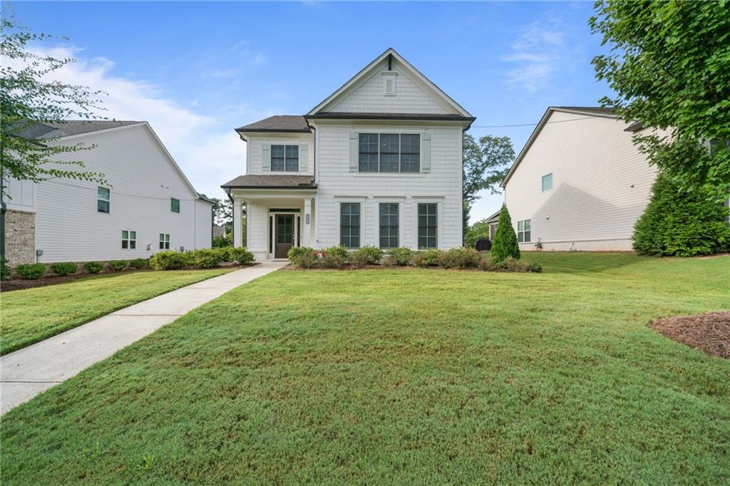 Welcome to this neat and tidy Briarwood plan home in the desired Avondale East community. Quickly you'll appreciate the beautiful entrance appeal and outdoor charm with a tastefully landscaped lawn, driveway, and a privately fenced yard. Make your way through the front door into an over-sized open concept family room with a cozy decorative fireplace paired with custom built-ins. Lots of natural daylight enhances the sense of spaciousness with the gorgeous kitchen perfect for both relaxation and entertaining. The elegant kitchen has generous cabinet storage, quartz counters, walk-in pantry, large island with counter for stools, stainless appliances, and a kitchen dining area. Completing the main level is hand-stained solid hardwood stair treads, hand scraped engineered floors, closets, powder room, mudroom, 2-car roomy garage, and back door to the covered patio. Stunning wood stairs take you to the upper level with hardwood on the landing and hallway, 2 spacious secondary bedrooms with vaulted ceilings connected to a jack-and-jill private bathroom, and a generous laundry room. The upper floor owner's suite is extra-large perfect for family, study, or other personal uses, well suited with 2 walk-in closets, tray ceiling, and a bathroom with a glass and tiled shower, huge soaking tub, private water closet, and double vanity. This beautiful home is adjacent to the Stone Mountain Trail and a short distance from downtown Avondale with new green space, restaurants, and breweries. Perfectly located less than a mile from the charm and energy of the historic downtown Avondale Estates with restaurants, retail, breweries, community events and the new Town Green. You're just minutes from the DeKalb Farmers Market, multiple parks, the PATH and top-rated schools, with a short commute to Downtown Decatur, Emory, CDC and major highways. Schedule your tour today and come see this amazing home!!
