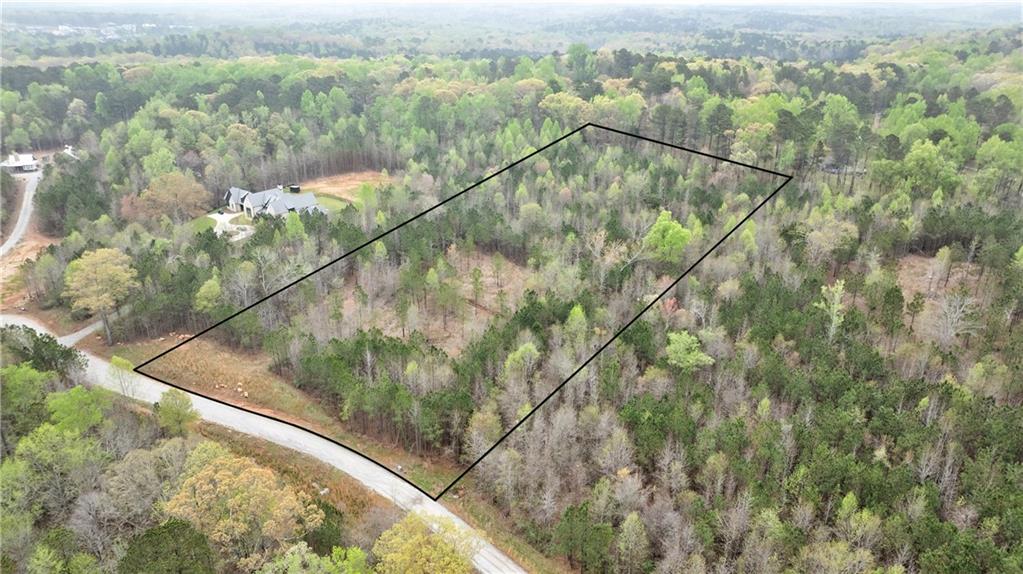 The ideal balance of convenience and privacy, this 6.89+/- acre Serenbe Farmette is located a short 5 minute golf cart ride from all the amenities Serenbe has to offer. With gently sloping topography and a generous 1 acre build site, there is ample space to build your retreat along with a guest house, garden, and pool. Bring your favorite builder, architect and designer to meticulously plan your new home, there are no build time restrictions.