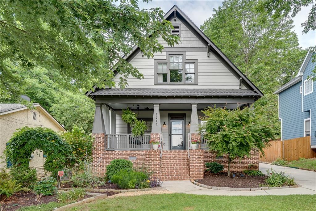 Your Intown Retreat awaits! Coffered ceilings, Crown Molding, and Custom Tilework compliment a Flowing and Functional Floorplan at this Craftsman Home. A large, Rocking Chair Front Porch welcomes you into a Fireside Family Room with Built-in Cabinetry, bordered by a Flex Office or Fourth Bedroom. Hardwood Floors throughout lead to a Renovated Farmhouse Kitchen with Professional-Grade Stainless Steel Appliances and Pantry. Unwind in the Oversized Primary Suite with Private, Tree-lined Balcony and newly renovated Spa-Style Bathroom with Dual Vanity, Stand alone tub, and oversized double Shower. Entertain with Ease on the Rear Deck overlooking a Fenced Backyard with an automatic entrance Gated Parking Pad under a 20x20 tongue and groove ceiling carport. Fantastic Ormewood Park/Woodland Hills Location! Minutes from the Southside BeltLine , Shopping and Dining in East Atlanta Village, and Easy I-20 Access to all of Atlanta. Listing Agent is the owner of the home.