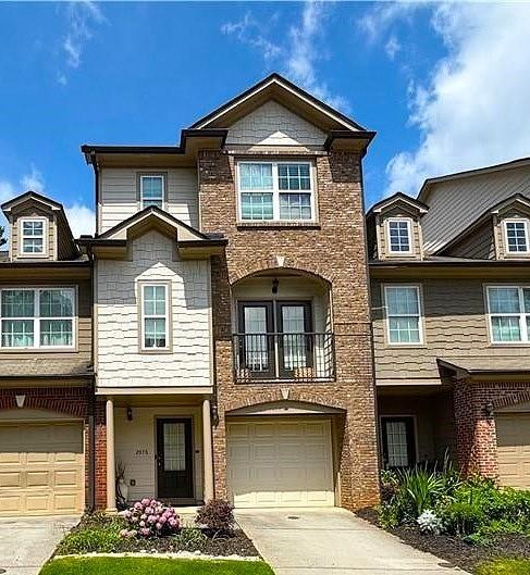 Welcome to 2976 Ashlyn Crest Court in Doraville, GA a stunning brick-front townhome located in a gated community. This beautifully maintained 4-bedroom, 3.5-bathroom home comes with a finished terrace level bedroom/bonus room. You will enter through the front door into the foyer which leads you to a spacious bedroom with its own exterior entry on the terrace level, complete with a full bathroom. This room is perfect for an at home office, playroom, guest suite, or the ultimate man cave. Upstairs, the main level features hardwood floors and a large living room with a fireplace and custom built-in bookshelves. The chef-style kitchen includes granite countertops, stainless steel appliances, and an eat-in breakfast area. Enjoy outdoor living with a walkout balcony, a separate deck, and a patio. On the third floor, you will find the additional bedrooms, a guest bathroom, a laundry room, a linen closet, and a nice size primary suite. The primary bathroom has been fully renovated and features designer tile, a frameless glass shower with multiple body jets, a true soaking tub, double sinks, and a smart Nutone exhaust fan with LED lighting and Bluetooth. This bathroom is the ultimate spa-like retreat. Additional perks include a one-car garage, brand-new HVAC system, and brand-new carpet that will be installed before you move in. Perfectly located close to parks, schools, restaurants, shopping, and major highways, this home truly has it all. Schedule your private tour today and apply because your next chapter starts here!
