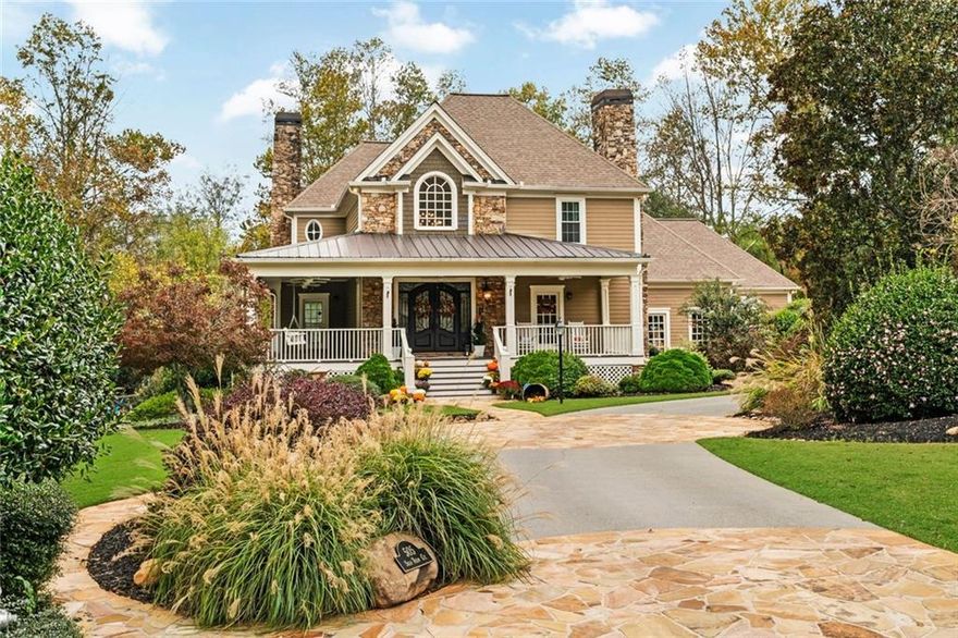 Discover Bradshaw Farms best keep secret in this amazing Estate Style nestled on 1.49 acres at the end of a private cul-de-sac and backs to your own private oasis surrounded by golf course on Red Course #1 green and Red #2 fairway. This is not just a house, this is a home. This is Southern living at its finest in this grand style home with a true wrap around front porch. You will fall in love with this home from the moment you enter the spectacular custom double doors that opens to the welcoming two story foyer, curved staircase and warm, inviting hardwood flooring that flows through most main living areas. This home embodies timeless elegance and modern comfort, all in a setting worthy of lingering good nights and sunlit mornings. Home features three full kitchens, a full finished basement, in-ground pool and storage galore. The private carriage house apartment adds charm and includes a two car garage. Beautiful formal living room with fireplace, leads to gorgeous oversized formal dining room. The coffered-ceiling family room with a stacked-stone fireplace, built-in shelving, and full-height windows that overlook your private oasis backyard. The updated chef’s kitchen features quartz countertops, a six-burner gas range with custom vent hood, subway tile backsplash, a large center island, stainless steel appliances, walk-in pantry, and a butler’s pantry. Just off the kitchen is the light bright breakfast nook with shiplap walls, wraparound windows, and a double tray ceiling with coffered detailing, a perfect place to start the day. The main-level primary suite is a private luxurious retreat. A double tray ceiling crowns the spacious bedroom that includes a sitting room or office, private access to the back deck, and a spa-inspired en suite bathroom with dual vanities, a jetted soaking tub, a walk-in tiled shower with dual shower heads,  oversized walk-in closet with direct access to the laundry room. The beautiful winding staircase leads to the upstairs that offers three large bedrooms and two full baths, The finished lower level is a full living space of its own, complete with two flex rooms currently used as bedrooms, a full bath, a second kitchen, a game room, a theater room, and a cozy third fireplace. This level opens out to the backyard and covered patio. Outside you’ll find a dream backyard that reaches new heights and built with no detail overlooked for outdoor living and enjoyment for every season, fully fenced and professionally landscaped. A gunite in-ground pool  includes a full outdoor kitchen, firepit, and gazebo with a centerpiece fireplace, creating the ultimate space to gather or unwind. The detached carriage house offers even more,  a full kitchen, living area/bedroom, laundry and bathroom, ideal for guests, extended stays, or extra income potential. This estate combines superb architectural details, lush grounds and the tranquility to let you enjoy all this home has to offer.  Bradshaw Farm amenities can't be beat, You will enjoy access to multiple pools, tennis courts, pickleball, volleyball, basketball, a clubhouse, and playgrounds, with an amazing Golf course, all in one of Woodstock’s most desirable neighborhoods.