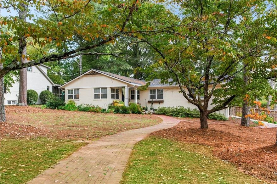 Absolutely phenomenal renovated ranch in West Side Elementary District about 1 mile west of the Marietta Square, right outside the gates to Anderson Farm.  The home was renovated in 2020 but has SINCE also received a custom laundry room, a new expansive deck, fresh designer paint throughout, a new furnace and a new water heather!  Gorgeous open concept kitchen with white cabinets, quartz counters, stainless appliances and a large island looking out to the living room.  Upgraded designer light fixtures throughout, gorgeous REAL hardwoods in every room, Carrera marble topped vanities in the bathrooms, and the have added a beautiful large deck on the rear of the home perfect to end-of-summer BBQ get togethers!  Large level lot with the backyard fenced in.  1 Car carport plus an additional 2 spaces on a parking pad.  And to top it all off --- there's a spectacular view of Kennesaw Mountain from the front porch!