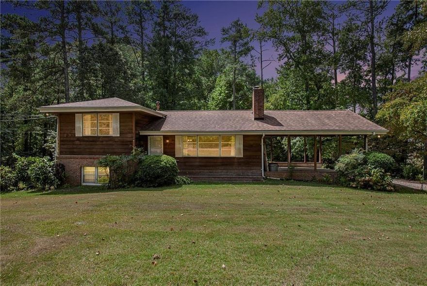 This home features a WORLD of possibility! Located in a very sought-after part of Marietta, this home is situated on 2.5 Acres which could be rezoned into gorgeous commercial or mixed-use property. This could also just be a home you call your own, with a little TLC and some updating this beauty with the land could easily be very equity-rich. Home has two kitchens and two living spaces with 4 bedrooms and two baths. The home is set up with a roommate floor plan in mind, there is so much that you could do with the abundance of space. The Land is flat and extremely useable. Come and see it today, let your imagination take over.