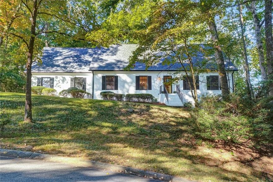 Welcome to 197 Carriage Trace, Marietta - a thoughtfully updated 4-bedroom, 4-bath home in the highly sought after Wheeler High School district with its nationally recognized magnet program. This home shines with a brand-new roof (September 2025), fresh interior and exterior paint, updated bathrooms, and the removal of popcorn ceilings for a clean, modern feel. The main level features a welcoming family room with a cozy fireplace, an inviting dining area, and an updated kitchen with granite countertops and stainless-steel appliances. Off the garage, a convenient mudroom with a back staircase adds both functionality and charm. Enjoy outdoor living at its finest on the screnned-in porch and adjoining deck, perfect for relaxing or entertaining while overlooking the large, flat fenced backyard. The partially finished daylight basement offers flexible living space with both interior and exterior entry-ideal for a media room, playroom, or gym - while the unfinished portion provides abundant storage. Practical updates include a main level HVAC system replaced in August 2022, giving peace of mind for years to come. Located on a quiet residential street that leads into a cul-de-sac, this home offers the best of both privacy and community. Optional membership to nearby swim and tennis facilities is also available. A rare find in East Cobb - this move-in ready home blends comfort, convenience, and top-tier schools. Don't miss it!