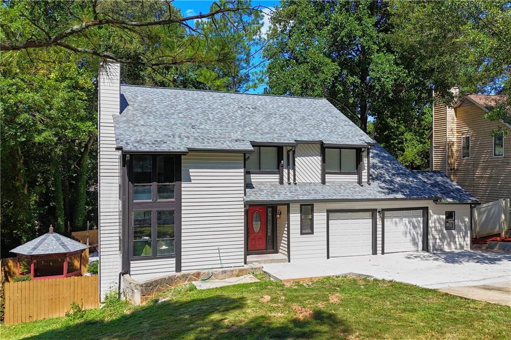 Welcome to this beautifully renovated 3-bedroom, 3.5-bathroom home with a private swimming pool, finished basement, and gazebo, located in the prestigious Hidden Hills community of Stone Mountain.
Thoughtfully upgraded throughout, this home blends modern elegance with functional design. The exterior boasts fresh paint, a brand-new roof, and new gutters, enhancing its curb appeal and long-term value.
Inside, the open-concept layout features soaring ceilings in the living room, complemented by dramatic floor-to-ceiling windows that flood the space with natural light. Oak luxury wood flooring flows through the main living areas, paired with fresh interior paint and stylish modern light fixtures.
The chef’s kitchen is both stunning and practical, showcasing quartz countertops, a sleek backsplash, new stainless steel appliances, and a large island—also finished in high-end quartz. A cozy breakfast nook offers the perfect spot for casual dining.
An additional living area with its own fireplace provides a flexible space for entertaining, relaxing, or creating a home retreat.
Upstairs, the spacious primary suite includes a versatile flex space ideal for a home office or private lounge. The spa-inspired en-suite bathroom features a custom free-standing soaking tub, a beautifully tiled shower, dual vanities, and a linen closet. Brand-new plush carpet adds comfort to all bedrooms, while bathrooms are finished with elegant new tile flooring.
Enjoy year-round comfort in the sunroom—a peaceful space perfect for morning coffee or hosting guests. Step outside to your backyard oasis, complete with a private swimming pool, gazebo, grilling area, and deck—ideal for outdoor entertaining and quiet relaxation.
The finished basement, with its own entrance path to the driveway, includes a second kitchen, full bathroom, home theater, and a spacious living area—perfect for in-laws, guests, or potential rental income.
This move-in ready home offers luxurious upgrades and a prime location in one of Stone Mountain's most desirable neighborhoods.
Don’t miss your opportunity—schedule your private tour today!