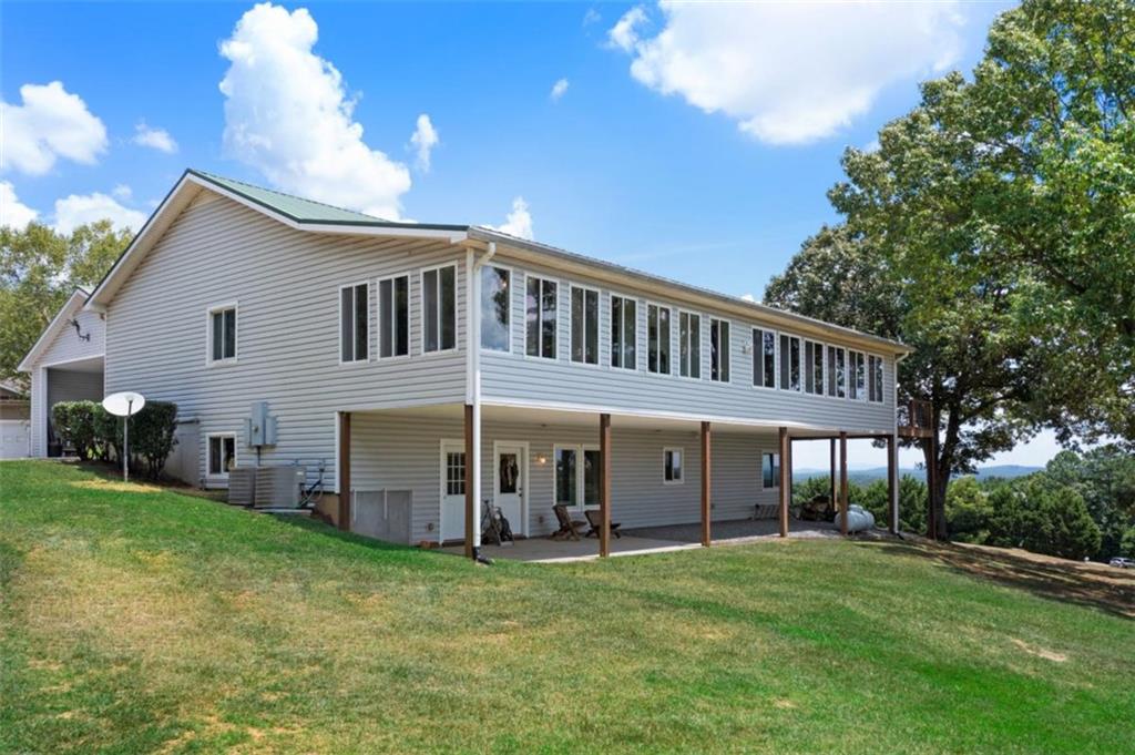 Stunning Views Multi-Gen Living Custom Built New Price! Motivated sellers! This beautifully designed custom home offers incredible mountain views and flexible space perfect for multi-generational living. The main level features an open-concept layout, sunroom, large porch, kitchen with large pantry, spacious laundry, and a luxurious primary suite with attached office and massive walk-in closets. Downstairs, enjoy a full walk-out basement with its own living room, kitchen, 2 bedrooms, bath, second laundry room, storm shelter, and tons of storage. With room to spread out and unmatched scenery, this home truly has it all. Endless possibilities-schedule your private tour today!