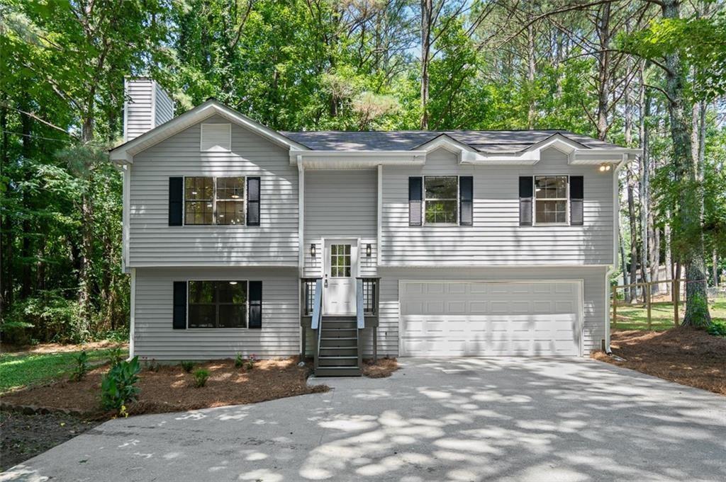 4.75% Interest Rate for a limited time! Or receive $9500 in closing costs! Welcome Home ATL to 3646 Lenora Church Road, a turnkey gem in the heart of Snellville. This updated home features hardwood floors, abundant natural light, and a bright kitchen with recently upgraded appliances. The spacious layout includes refreshed baths, sizable bedrooms, and a large, level backyard perfect for entertaining or relaxing. A two-car garage adds everyday convenience. With its move-in ready condition and unbeatable location near schools, parks, and shopping, this home is a smart choice for today’s buyer.