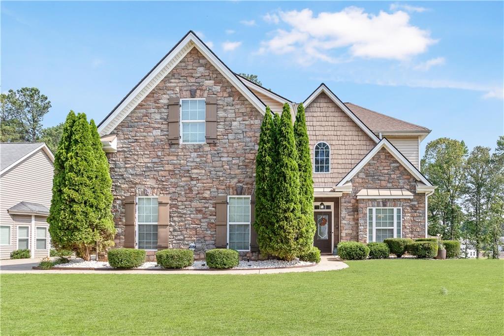 WOW - Come and check out this BEAUTY in Bremen City Schools in the sought after neighborhood of Creekside. So close to everything and easy access to I-20. This home is one of the quality original build homes with HUGE Open Floor plan on the main - Kitchen with island, granite countertops, SS appliances, Separate dining with butler's pantry and bedroom on the main level. This one has everything you need with fenced in backyard for the fur-babies and loads of space upstairs. You will fall in love with the upstairs man-cave or use as bonus space for gaming and/or children's playroom. Spacious secondary bedrooms and massive Master Suite with oversized bedroom, walk in closet, separate soaking tub and shower with double vanities. Hurry before this beautiful home is gone.