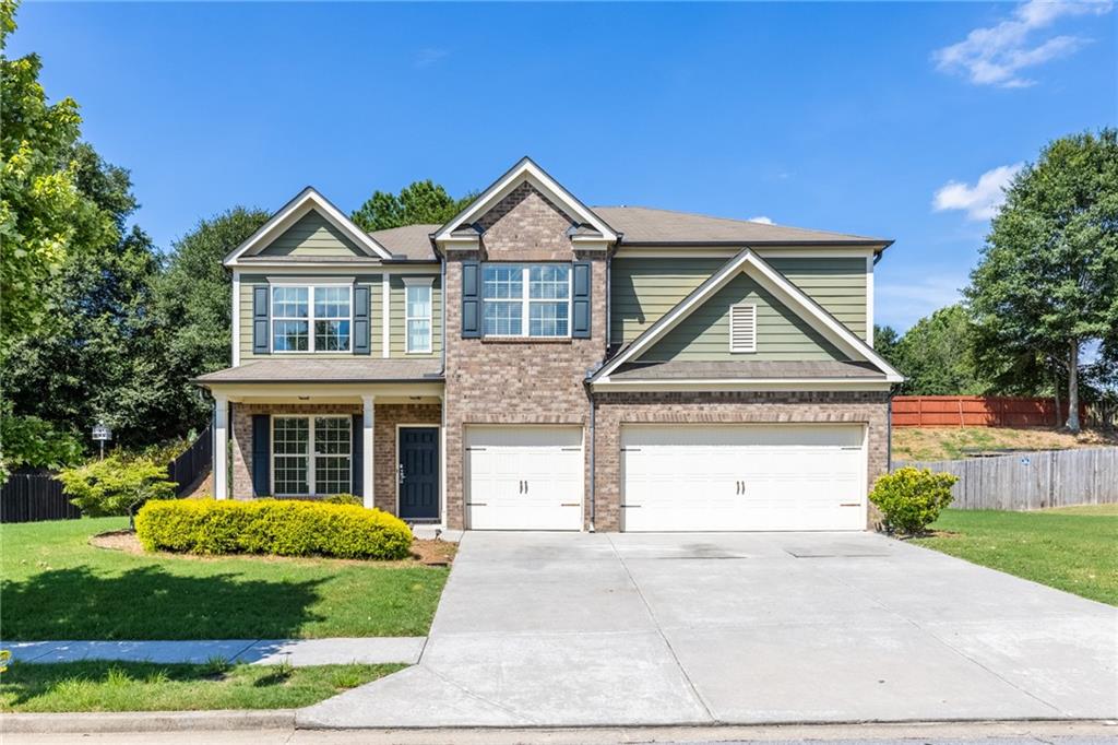 BRAND NEW CARPET AND BRAND NEW PAINT!!! The stunning home in the most sought out Mill Creek HS district! Convenient location and easy access! Open and bright floorplan with high ceilings, hardwood on main floor, coffered ceilings in dining room. This bright and airy floorplan allows the view of the family room from the kitchen and has bedroom and full bath on main! Upstairs has huge loft area with bar that can be used as kids' playroom, office area, entertainment, etc. Oversized master has sitting room with fireplace for cozy and peaceful getaway environment! Master bath includes double vanity, separate tub/shower, walk in closet. Spacious secondary bedrooms and one of the best leveled lots in the community! Private and level backyard. Perfect home for entertainment and/or peaceful retreat- best of both worlds!