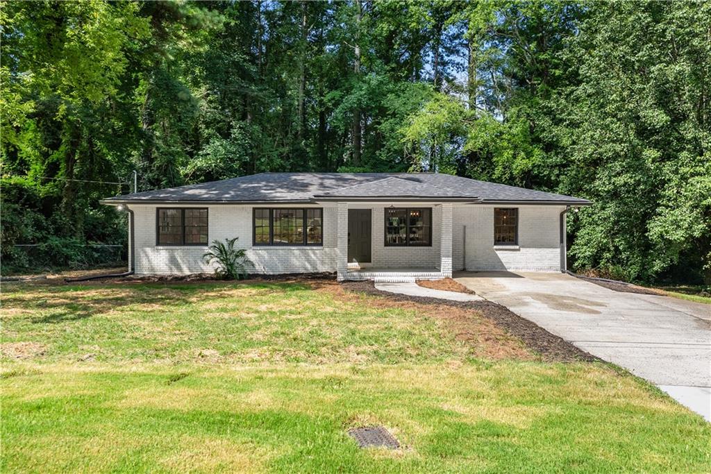 Freshly renovated and full of character, this 3-bedroom, 2-bath home offers modern upgrades without sacrificing warmth or charm. Step inside to find beautiful real hardwood floors, an open-concept living and dining area, and a completely updated kitchen featuring stainless steel appliances, stunning marble-style countertops, and custom cabinets that add both style and function. Both bathrooms have been thoughtfully remodeled with stylish tile work and updated fixtures, creating a clean and contemporary feel throughout. The frameless glass enclosure for the primary bathroom shower will be installed this week, adding the finishing touch to this beautifully updated space. The brand-new roof adds peace of mind, and the spacious laundry room offers extra convenience for daily living. Nestled in a quiet area of Austell with easy access to major highways, this home blends comfort, quality, and thoughtful design—ready for you to move in and make it your own.