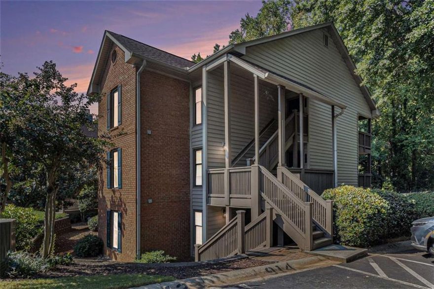Great opportunity to live in the heart of Sandy Springs. Beautifully updated condo with open floor plan. Features  spacious living room with cozy fireplace and hardwoods, kitchen with granite, stainless and new lighting. Enjoy extra large primary ensuite and oversized secondary bedroom with updated guest bath. New windows. End unit, deck with private view. Move in ready. Designed for comfort, style and low maintenance living. Swim/tennis community with scenic lake. Walk to dining and shopping. Convenient to all expressways.