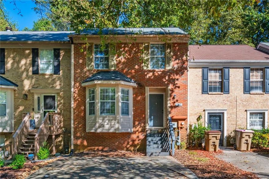 Welcome Home - terrific opportunity for first time home buyer, roommates, or landlord. This Town Home is conveniently located to 75, Express Lanes, KSU, Shopping and more! Master on Main with 2 additional Bedrooms and a shared Bathroom upstairs and Hardwoods throughout, up and down.  Kitchen has Granite Counters, Gas Range and Breakfast Island and open to Family Room and Dining Area. Open Family Room and Dining Area has Wood Burning Fireplace, Vaulted Ceilings and access to a generous sized Back Deck. Enjoy the Private Backyard views from the deck. So much potential in the huge Unfinished Basement - perfect for storage, workout room or finish off for additional living space. Access backyard with raised bed through the basement. Fee Simple, No HOA Dues, your own yard, 2 designated parking spaces.