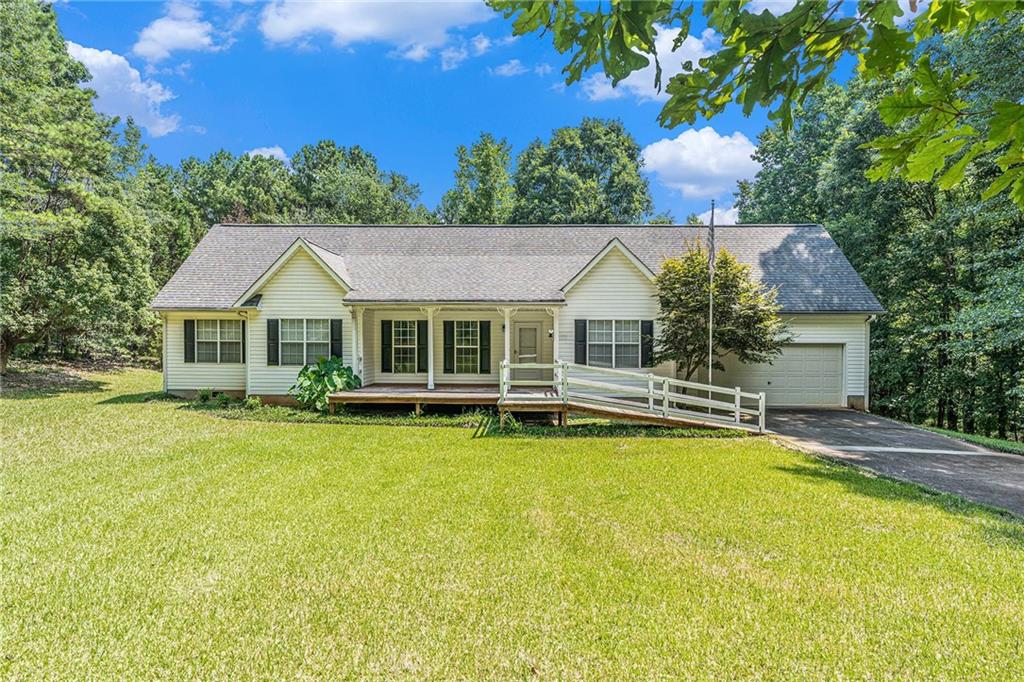 WELCOME TO THIS CLASSIC RANCH STYLE HOME ON OVER 3 ACRES IN OLA SCHOOL DISTRICT!! As you adventure down the long driveway you will encounter the ultimate in serene privacy. The Home Features An Eat-in Kitchen, Separate Dining, a Family Room With Soaring Ceilings and Wood Burning Fireplace. The Primary Bedroom Has Its Own Bath. The Secondary Bedrooms Are Roomy And Have Ample Closet Space. The Home Also Features A LARGE UPSTAIRS BONUS ROOM. Take In The LUSH LANDSCAPE From The Deck. It's ready for you to make it your own.
