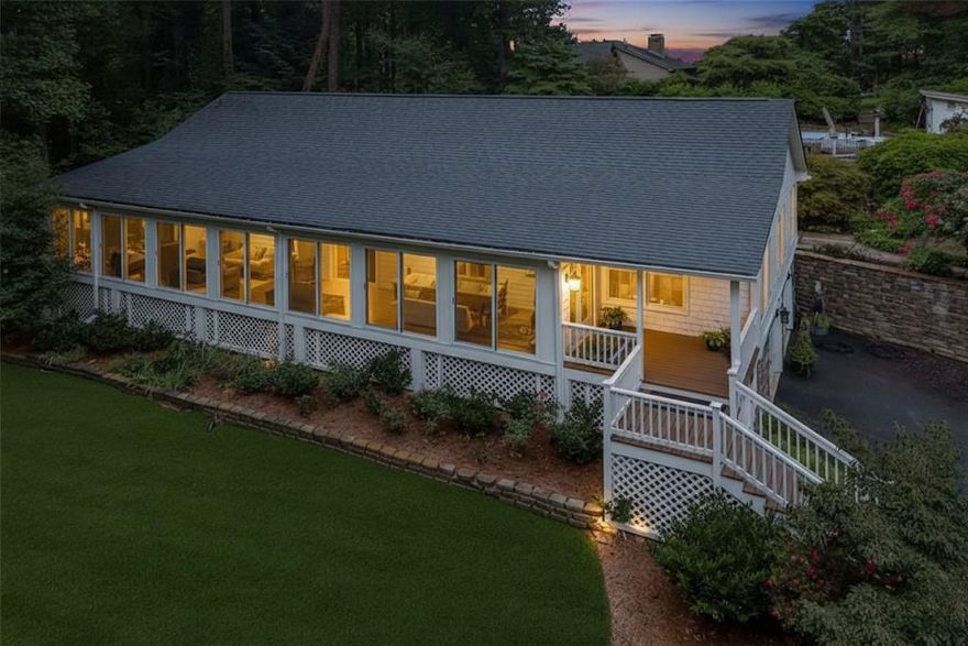 Privately situated retreat on 2.3 acres with a pool in highly coveted East Cobb, served by top-rated schools and located less than 10 miles from Downtown Roswell, Milton, Alpharetta, and Woodstock. New HVAC main unit (2023) & sunroom unit (2021), new siding & exterior paint (2023), new water heater (2022), septic pumped (2025) and refinished hardwood flooring (2025). Gourmet kitchen features custom cabinets, granite countertops, a walk-in pantry, a grand island with pull-out pet bowls, and a breakfast bar complete with a bar sink. Luxurious primary suite offers spa-like bath including custom counter-height double vanity and built-in shelving in the private water closet. Walk-in closet is a dream, with built-in dressers, an 8-tier shoe rack, and ample overhead shelving. Two secondary bedrooms share a Jack & Jill bath w/separate vanities & built-in dresser closets. Lower level includes spacious mudroom includes built-in shelves, bench seating with storage, coat/backpack hooks & USB/power outlets, a bedroom, a full bath, living area, and laundry room with built-in washer/dryer cabinet, utility sink & shelving. Outdoor living includes a 3-tier deck leading to an in-ground fiberglass pool with custom storage. Additional features includes solid wood interior doors, whole-house fan, and garage cabinetry with utility sink. Schedule your showing today!