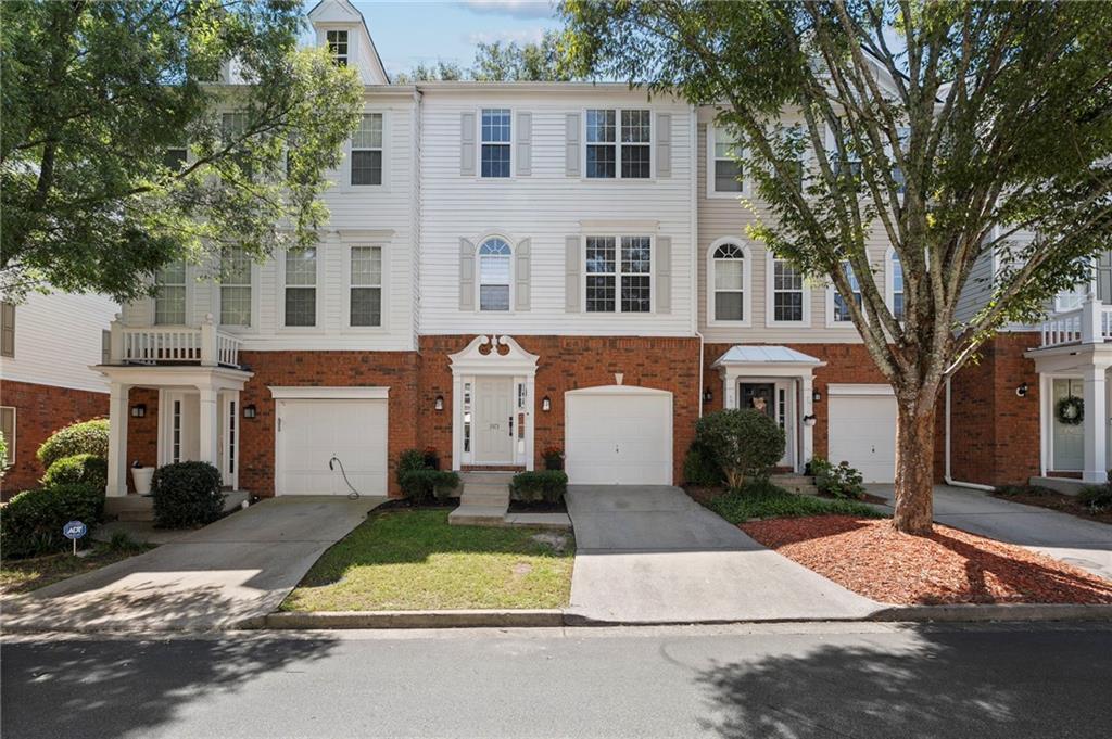 Stunning Updated Townhome in Morris Lake Subdivision! Beautifully maintained and thoughtfully updated, this spacious home offers style and function in one of the area’s most desirable communities. The lower level features a bright bedroom with closet and half bath, upgraded with wide-plank luxury vinyl flooring in both the bedroom and closet, along with solid hardwood stair treads. The main level boasts hardwood floors, a large family room with fireplace, and a renovated kitchen with sleek quartz countertops, stainless steel appliances, built-in microwave, gas cooktop, stylish backsplash, updated lighting, added shelving, and new pull-out drawers in the lower cabinets. From here, step out to a huge deck with a built-in bar bench, perfect for entertaining. Upstairs, the wide-plank vinyl continues throughout all bedrooms. The primary suite includes a walk-in closet with built-ins and a beautifully updated bath with double vanity, Corian countertops, and tile flooring. Two additional bedrooms share a full bath, and the laundry is conveniently located on the same level. A top-loading washer and dryer will remain with the home. Exterior and system updates include freshly painted siding, updated landscaping, a replaced and repainted patio, modern outdoor lighting, a new roof, new water heater, and dual HVAC units. The Morris Lake community offers a private lake with walking trails, swimming, and more. Ideally located just minutes from GA-400, Windward Parkway, Avalon, North Point Mall, and top schools—with a new GA-400 exit being added nearby—this home combines modern upgrades, spacious living, and unmatched convenience. Qualifying veterans, this home has an assumable VA loan, reach out for details