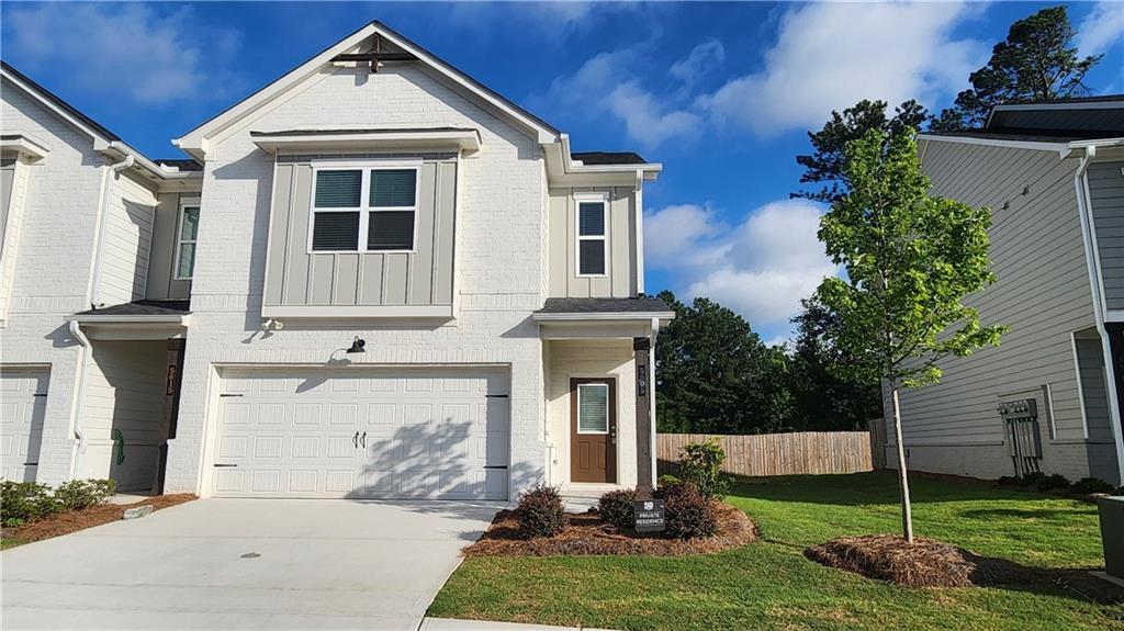 Stylish 3 Bed , 2.5 Bath End Unit in Townhome in Gated Community ! Step into this beautifully maintained 2023 built end unit townhome, located in a secure gated neighborhood with exceptional curb appeal and modern finishes throughout. Inside you'll find fresh interior paint, a spacious and inviting open-concept main level featuring a bridge living area and a sleek kitchen outfitted with stainless steel appliances, a large center island, tall white cabinetry, tile backsplash, and stunning stone countertops- perfect for entertaining or relaxing in style. Enjoy the privacy of your back patio, along the convenience of a 2 car front entry garage. Upstairs, a split bedroom layout surrounds a versatile loft area, ideal for additional living, office, or flex space. The laundry room is thoughtfully located on the upper level for easy access. This home blends comfort, style and functionality - all within a gated community.