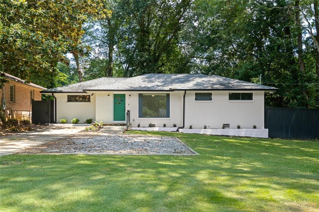 This beautifully renovated home offers the best of both worlds: timeless finishes with a fresh, modern feel, all located in one of Atlanta’s most vibrant and convenient neighborhoods. Just minutes from East Lake Golf Club, downtown Decatur, and Kirkwood, the setting provides an ideal combination of lifestyle and accessibility. Inside, you will find real hardwood floors throughout, an open and light filled layout, and an all white kitchen featuring granite countertops, a center island, and stainless steel appliances. The spacious primary suite includes a fully customized closet system and a spa inspired bathroom with a rainfall shower and designer tile selections. Fresh interior paint and recessed lighting enhance the home’s bright and inviting atmosphere. Additional features such as sliding barn doors, updated systems, and stylish finishes make this residence truly move in ready. The fully fenced backyard has been newly turfed for low maintenance, year round enjoyment. A generous deck, fire pit area, and storage shed offer the perfect space for relaxing or entertaining. Ample parking for multiple vehicles is available, and all appliances including washer and dryer will remain with the home.