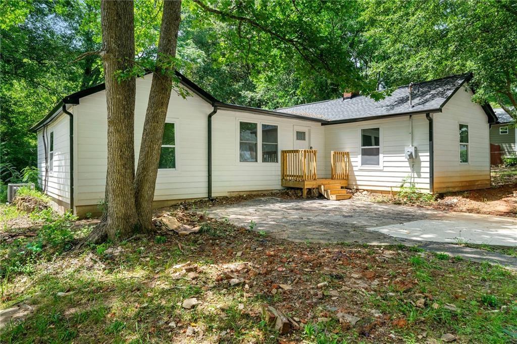 Check out this beautifully renovated home, only a few minutes walk from Downtown Newnan’s restaurants and shops! This home is larger than it appears and boasts plenty of updates. Open the front door to gleaming new floors and tons of natural light throughout with all new windows. This home features a spacious open floorplan, connecting living, kitchen and dining rooms, perfect for entertaining friends and family. Whip up delicious meals in your chef-ready kitchen with white cabinets, sparkling granite countertops and new Stainless Steel Appliances. Relax in your private master with walk-in closet and refreshing ensuite bathroom. Enjoy the space of 3 additional guest bedrooms, full guest bathroom, convenient half bathroom and hallway laundry. Spend evenings relaxing on the new side deck overlooking your backyard. Or walk to it all; Lynch Park Pool, Boys and Girls Club, Downtown Bars, Restaurants and Shops. Don't miss out on the opportunity to make this renovated house your new home. Schedule a showing today and experience the best of Newnan living!
