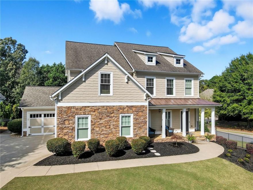 MAGAZINE-WORTHY SHOWSTOPPER IN BRIDGEMILL! This beautifully updated Craftsman-style home WITH A PRIVATE POOL & OVERSIZED HOT TUB is nestled on the corner of a quiet cul-de-sac street in the highly sought-after Bridgemill community, offers refined living at its finest. With 4 spacious bedrooms, 4.5 bathrooms, and a fully finished terrace level, this meticulously maintained residence combines elegance, comfort, and versatility. Upon entry, you are greeted by a welcoming foyer that flows seamlessly into the formal dining room, elegant living room, and a chef-inspired kitchen. The kitchen is a standout, featuring quartzite countertops, upgraded backsplash, and a cozy keeping room. A double-sided fireplace creates a seamless connection between the kitchen and living room, offering the perfect setting for both relaxation and entertaining. The upper level features a luxurious primary suite with double-door entry, his and hers walk-in closets, and a newly remodeled spa-like bathroom with an oversized glass shower and high-end finishes. Three additional spacious bedrooms provide ample space, with one offering a private en-suite bath and the others connected by a Jack-and-Jill layout. The finished terrace level is ideal for in-laws or teens, complete with a private entrance, large family room with a fireplace, full bath, bar, kitchen, and a flexible office or 5th bedroom. This space offers the perfect combination of privacy and functionality. Step outside to your private backyard retreat, accessed from the kitchen, featuring a screened-in porch that overlooks a beautifully landscaped yard and a resort-style saltwater heated POOL with an oversized spa—ideal for outdoor living and entertaining. Additional highlights include a 3-car garage with plenty of space for storage. Don't miss the amenities that residents can enjoy which include Bridgemill Athletic Club--including an 18-hole golf course, driving range, 2-acre resort-style pool, tennis and pickleball courts, a fitness center, & clubhouse restaurant. This stunning home offers the perfect blend of luxury and convenience—don’t miss the opportunity to make it yours!