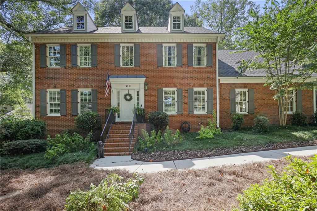 Tucked between the trails of Kennesaw Mountain and the vibrant energy of Historic Marietta Square, this stately three-sided brick home offers the quintessential West Cobb lifestyle. This renovated showpiece easily stands out from the crowd.
The main and upper levels boast hardwood flooring and a chef-inspired kitchen with solid-surface counters and stainless appliances. Every bathroom is designed with on-trend tile, double vanities and a spa-like soaking tub. The bright kitchen and sunny keeping room creates an open, airy feel, while a formal dining room comfortably seats a large dinner. Built-in bookcases, a fireplace and tray ceilings add architectural interest.
With 6 bedrooms and 4½ baths across 4,563 square feet, there’s room for multi-generation living, home offices and gym spaces. The finished terrace level includes a media room, full bath, bonus room and storage—perfect for a teen retreat or in-law suite. Upstairs, generous bedrooms offer walk-in closets and updated baths. A two-car garage sits on the kitchen level for easy grocery unloading, and there’s plenty of extra parking along the level driveway.
Situated on a .48-acre lot, the backyard is fully fenced and level with a mix of greenspace and wooded areas. An expansive deck invites outdoor dining, morning coffee or twilight stargazing. The HOA fee is a modest $150 per year, giving you well-maintained common area and street lights without breaking the bank.
You’re literally steps from Kennesaw Mountain National Battlefield Park. The park features 25 miles of trails that wind through Civil War earthworks and forests, including the Burnt Hickory trailhead and Hardage Mill loops. Morning hikes or weekend bike rides are part of daily life here, and the 16-mile full-park loop offers a serious workout.
Families will appreciate being zoned for West Side Elementary, an A-rated school with an 8/10 rating, followed by Marietta Sixth Grade Academy, Marietta Middle and Marietta High School. Marietta’s independent school district is known for its magnet programs and community engagement.
Meanwhile, Historic Marietta Square—the “historic and cultural centerpiece of Marietta”—is minutes away. Its 19th-century buildings house charming boutiques, galleries and restaurants, and the square hosts farmers markets, art festivals and food events throughout the year. West Cobb’s open-air shopping centers and grocery stores are also a short drive, giving you plenty of everyday convenience.
Given the combination of a fully updated home, desirable location and a market where homes are still in demand, this property represents both a lifestyle upgrade and a sound investment. Whether you’re looking for top-rated schools, trail-blazing adventure or a vibrant downtown culture, 518 Hardage Trace NW offers it all with a touch of Southern charm and just enough modern finishes to keep your inner designer happy.
Schedule your private tour today and experience why Hardage Trace remains one of West Cobb’s most coveted addresses.