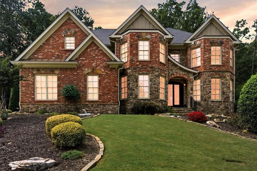This luxurious residence draws inspiration from New Homes Magazine. Upon entry through double iron and glass doors, the property showcases high-quality features including elegant hardwood floors, tray ceilings throughout, a walk-in pantry, and an expansive granite kitchen island. The home offers numerous upgrades, such as three fireplaces: a double-sided fireplace in the basement, a stacked fireplace in the two-story family room, and an additional fireplace in the primary bathroom. The main level includes a chef’s kitchen with a large island, an oversized dining room, a private library or study, a spacious family room, and a full bedroom with an en-suite bathroom.The upper floor features a primary suite with an exceptional walk-in closet and a spa-like bathroom, plus a sitting area. There is also a bedroom designed to function as a private suite, along with two more bedrooms each with their own bathrooms. The laundry room is conveniently located near the primary and secondary bedrooms. The finished basement provides another full bedroom and bathroom, offering ample space for a teen or in-law suite with a separate entrance. This distinguished three-sided brick home includes a generous enclosed sunroom overlooking a tranquil waterfall feature, a separate deck, and professionally landscaped grounds. The property is situated on a serene lot with access to swimming and tennis amenities.