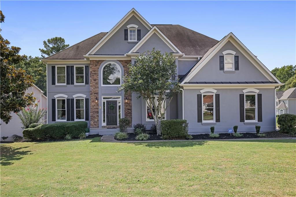 Welcome to a home designed for living, entertaining, and enjoying every season of life in Legacy Park — one of Kennesaw’s premier communities. With 6 bedrooms, 4.5 baths, and over 4,500 sq. ft. of beautifully updated space, this residence offers the perfect balance of elegance and everyday comfort.
The main level invites gatherings with its two-story great room, filled with natural light, and a chef’s kitchen where an oversized quartz island becomes the heart of the home — whether for morning coffee, homework sessions, or lively dinner parties. The formal dining and living rooms set the stage for celebrations both big and small.
Upstairs, retreat to the expansive primary suite with a spa-like bath, while additional bedrooms provide plenty of space for family and guests. The newly finished basement offers two more bedrooms, a full bath, and versatile open spaces ready for a home theater, gym, or game room. Step outside to a spacious deck and fenced backyard with stone patio — ideal for outdoor dining and play.
Life at Legacy Park feels like living in a resort, with pools, tennis, playgrounds, trails, sports fields, and year-round community events right at your doorstep. All of this, just minutes from I-75, top schools, shopping, and dining. This is more than a house — it’s a lifestyle.