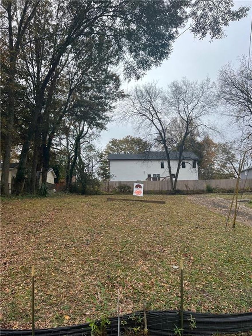 AWESOME buildable lot close to the Historic Marietta Square!  Over $1M custom house being built one street over!  Bring your own builder and build your dream house, or use our Award Winning Builder - Uppercut Homes (Ben Burney).  The lot is developed and cleared and is 130 feet x 53 x 121 x 53 - just over 1/3 of an acre.  Private street without much cut through traffic.  Feel free to walk the lot.