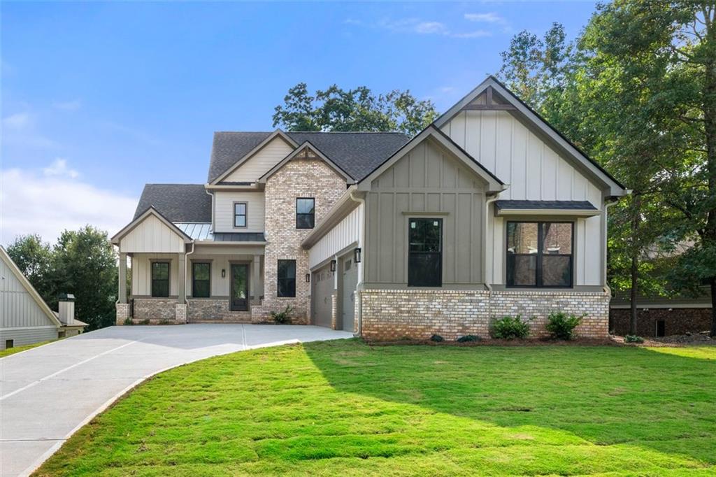 Welcome to this exceptional home in Traditions of Braselton, offering over 3,500 square feet of finished living space plus a 2,134 square foot unfinished basement with endless potential for customization. The floor plan is thoughtfully designed with two primary suites— one on the main level, featuring LVP flooring and a spa-inspired bath, and another upstairs—making it the perfect long-term home for families, multi-generational living, or empty nesters seeking comfort and flexibility. As you enter, you are welcomed by soaring ceilings and a double-height living area that fills the home with natural light and creates an inviting sense of openness. A versatile flex space on the main level offers the perfect setting for a private office, study, or playroom. The kitchen is a true centerpiece, featuring ceiling-height cabinetry, modern finishes, a built-in wine rack with chiller, and a wet bar/coffee bar that enhances both everyday living and entertaining. Attention to detail is evident throughout with custom wall treatments, stylish fixtures, and beautiful wood accents that provide warmth and character. The interior fireplace adds charm and comfort, while the outdoor fireplace anchors the generous exterior living space, perfect for gatherings or quiet evenings. Upstairs, secondary bedrooms are complemented by a spa-inspired bath experience, with both primary suites featuring shower and tub combinations designed for relaxation. The home is completed with a three-car garage featuring soaring ceilings, offering ample storage and utility space. The unfinished basement provides incredible potential for future customization—whether you envision additional bedrooms, a game room, a theater, or a home gym, the options are limitless. This residence combines elegance, functionality, and modern style, making it one of the most desirable floor plans in Traditions of Braselton. Schedule your showing today and discover a home that is truly move-in ready with room to grow.