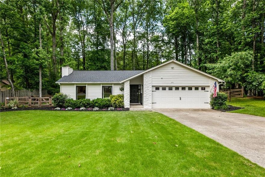 Lovely, renovated home on one of the best remaining .75 acre lots in the downtown Alpharetta garden district - walking distance to all that downtown Alpharetta has to offer. This adorable home has so many options for the buyer looking to live in one of the Atlanta area's hottest communities. Happily live in it now, or look to the future for this special bit of land... surrounded by multi-million dollar homes, this lot gives you the option to build the home you've been dreaming about. The existing ranch home has been updated with love: flooring, lighting, paint, and loads of exterior work to remove trees, develop the landscaping and maintain the property. Loaded with light, the living and dining spaces have high vaulted ceilings and an awesome floor-to-ceiling stacked stone fireplace. Kitchen has granite countertops, stainless appliances and plenty of cabinet space. Live in it as-is, add on, or start over to build your dream home on this spectacular lot. Primary bedroom is large with newer sliding glass door to the huge rear deck. Two secondary bedrooms are both large and share a tidy hall bath. Back yard is fully fenced. Windows were replaced in 2019, electrical box in 2017, and new HVAC with wifi-enabled thermostat in 2016.