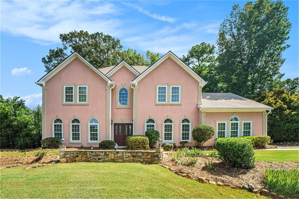 Stunning and spacious traditional home in the heart of East Cobb, offering over 3,500 square feet of thoughtfully designed living space in the top-rated Lassiter High School district. This move-in ready residence blends timeless design with modern updates, including fresh interior paint and a newly remodeled back deck that invites you to relax or entertain in style.
Inside, a grand two-story foyer with travertine flooring and elegant crown molding sets the tone. The fireside family room flows seamlessly into a gourmet kitchen featuring granite countertops, a large center island, breakfast bar, walk-in pantry, and eat-in dining area—perfect for gatherings and everyday living. A formal living room with French doors provides a quiet retreat, ideal for a home office or library.
Upstairs, the expansive primary suite features vaulted ceilings and a spa-like ensuite bath with dual vanities, a soaking tub, open walk-in shower, and a generous walk-in closet. Three spacious secondary bedrooms offer plenty of room and storage.
The private, professionally landscaped backyard is a true retreat, with wooded views, stone terraces, raised garden beds, and space for a vegetable or herb garden. Additional features include newer exterior paint, a recently replaced roof, and a side-entry two-car garage with extra storage.
Enjoy easy access to parks, shopping, dining, and all that East Cobb has to offer—plus a low annual HOA. A rare opportunity to own a beautifully updated home in one of Cobb County’s most desirable communities.