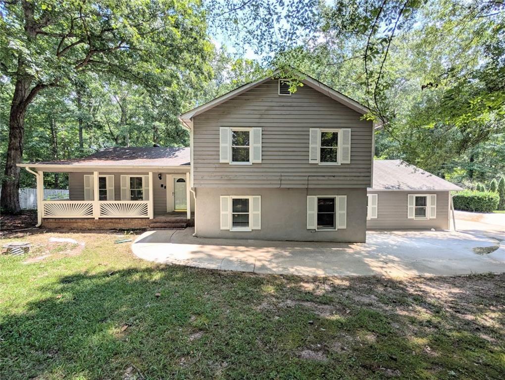 This home is eligible for Special 100% financing with NO PMI & below market rates. With plenty of living space on a full acre, this home offers comfort and convenience.
Inside, you’ll find a bright living room with a fireplace and an open floor plan. The main areas feature updated LVP, tile floors, hardwood stairs and newer carpet in the bedrooms for a fresh, move-in-ready feel. The kitchen and dining areas provide plenty of room for everyday living and entertaining. A covered patio overlooks the large backyard, giving you space to relax. The split-level layout includes generous bedrooms and three full bathrooms. A two-car garage and extended driveway offer ample parking and storage. Located close to Fayetteville Pavilion, shopping, restaurants, theme parks, and the airport, this home combines privacy and convenience.