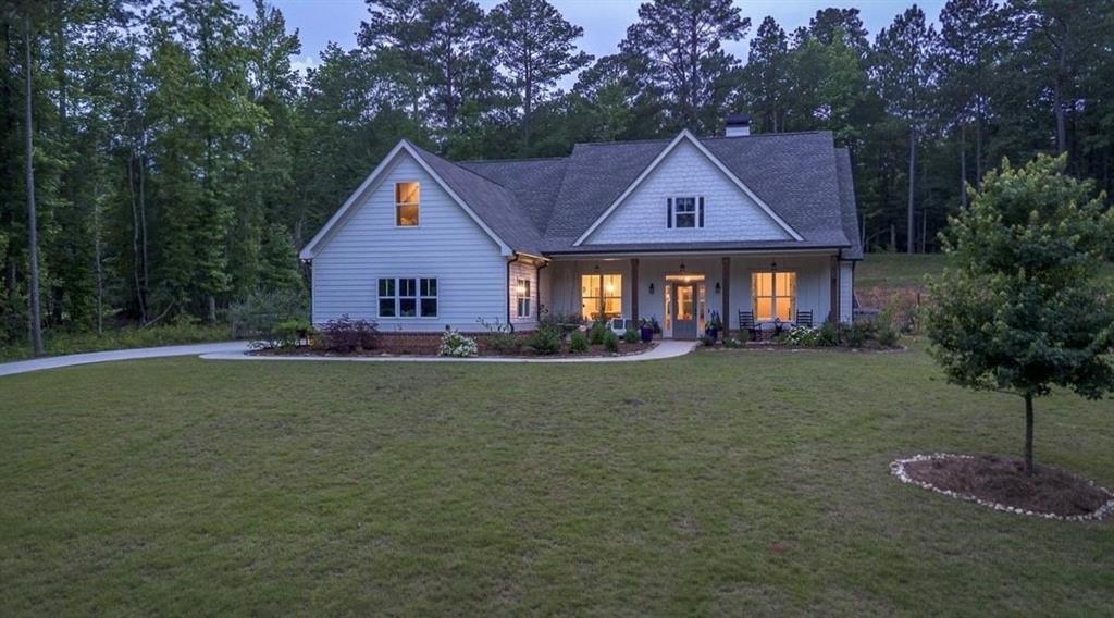 Come claim your little slice of heaven just outside the city limits of Monroe on beautiful Dean Hill Road! No HOA! Gorgeous estate homes on large lots line this area that's conveniently located in the popular Walnut Grove school district. This particular lot offers privacy galore! The home sits atop the sloped lot that levels off in the back to accommodate the board-fenced, heated in-ground, salt water gunite pool and lush garden area with precious potting station! Over 25 varieties of vegetables and plants, including cilantro, strawberries, blueberries, parsley & mint, a lemon tree, persimmon tree, rose bushes, magnolias..the list goes on- a true gardeners paradise!!! And don't miss the storage shed for lawn equipment & chicken coop on edge of property line so you can gather organic eggs daily! Inside you will find an open-concept floor plan with split-bedroom layout. Large kitchen with professional grade GE Profile stainless steel appliances and gas range, large island with bar seating, and breakfast area overlooking the pool. Separate dining room can seat 12. Mud room with hooks and bench for all the kids backpacks and sports equipment as well as utility sink and shelving for appliances. On one side of the home, you will find 3 full bedrooms: one with its own private bath and two that share a jack and jill bath. On the opposite side is the oversized owner's suite that leads to the pool deck. Master bath has walk-in shower, double vanity, and large soaking tub, as well as large walk-in closet. Use the upstairs bonus room as a 5th bedroom, office, playroom, or home gym! The outdoor area completes this home with a professionally lit pool area with pergola, fire pit area, and hot tub in addition to area for play set and more! Let the kids swim while you keep an eye on them from your kitchen windows!