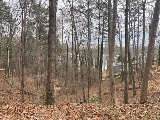 Great opportunity to build your dream house or camper retreat!! 3 lots in total with 29,620 Sq Ft or just under 3/4 acres and backs up to Army Corps property on Lake Allatoona! Very close to many Lake Amenities and LakePoint Sports complex making the potential for a Airbnb huge. The street address numbers are 49,53 and 55 and sold all together with a mix of Hardwoods and Pines and a great building area that would sit the house high on the property with views. Come check it out today!